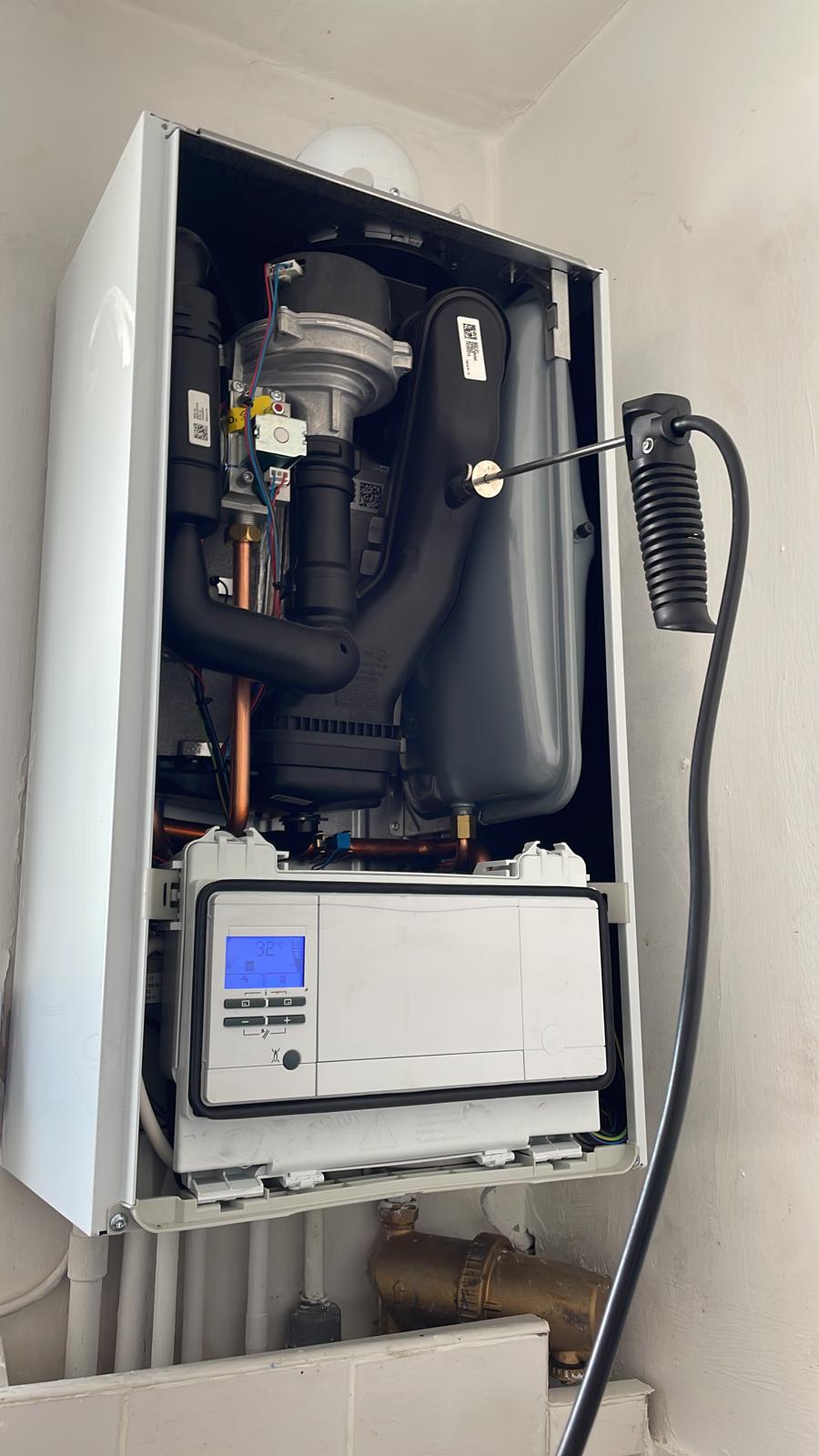 Boiler service with digital display showing active fault diagnostics by MAMOSS engineer