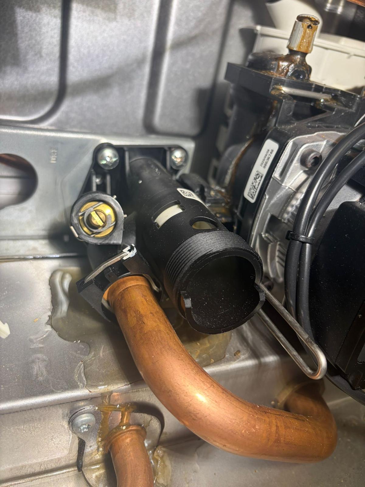 Boiler condensate siphon and copper pipework during heating repair