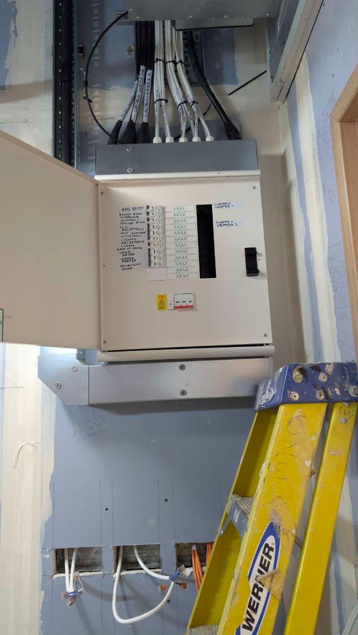 Labelled distribution board with circuit schedule mounted on site during London electrical installation