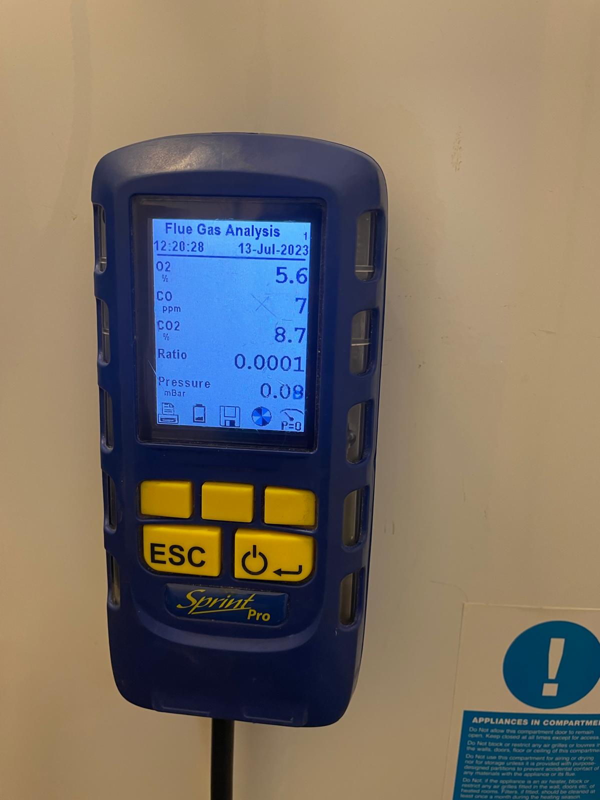 Sprint Pro flue gas analyser displaying combustion analysis readings during boiler safety check