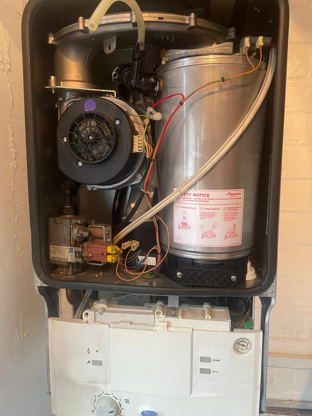 Worcester Bosch combi boiler opened for annual gas safety service in London